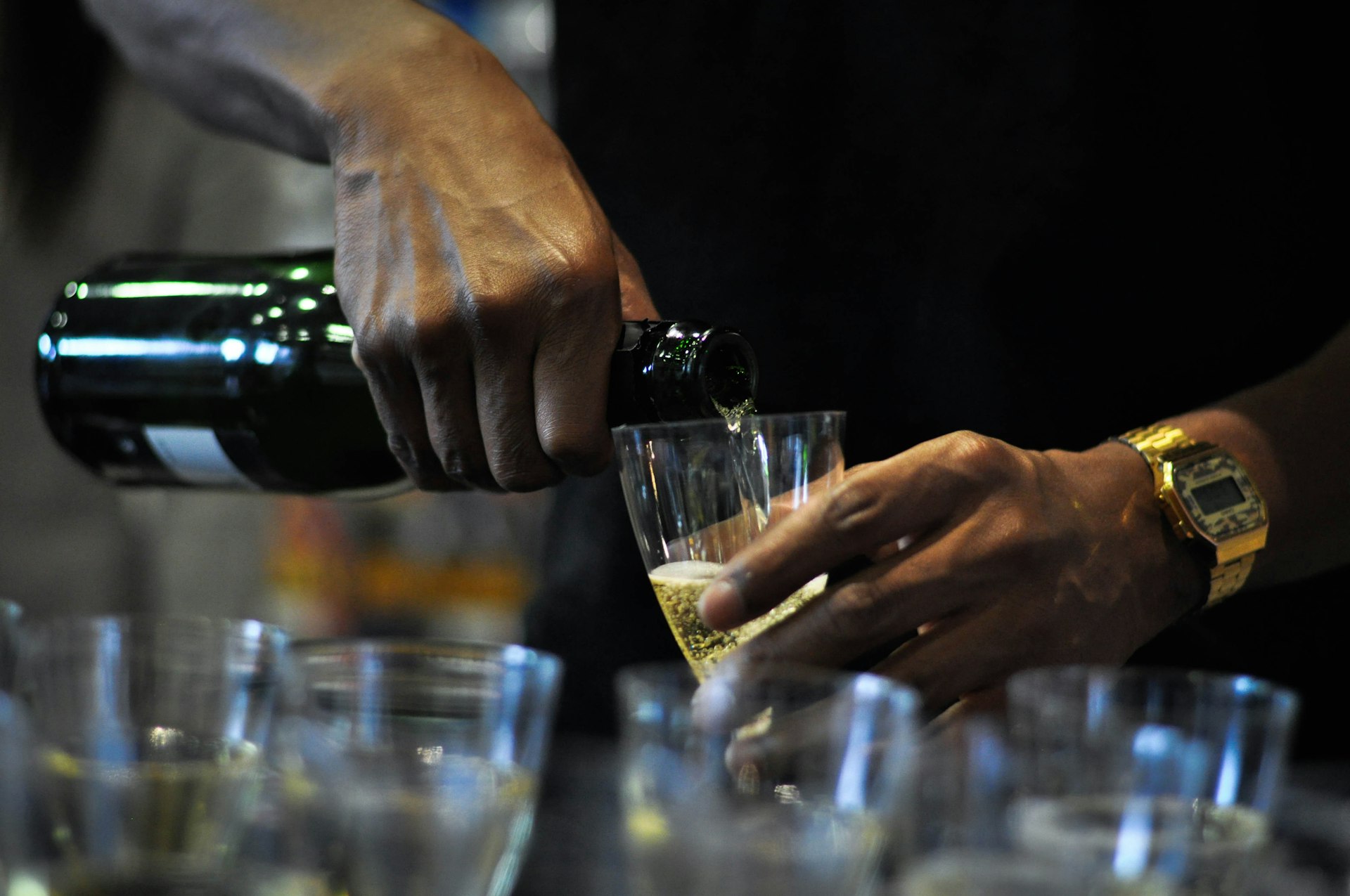 person holding clear drinking glass